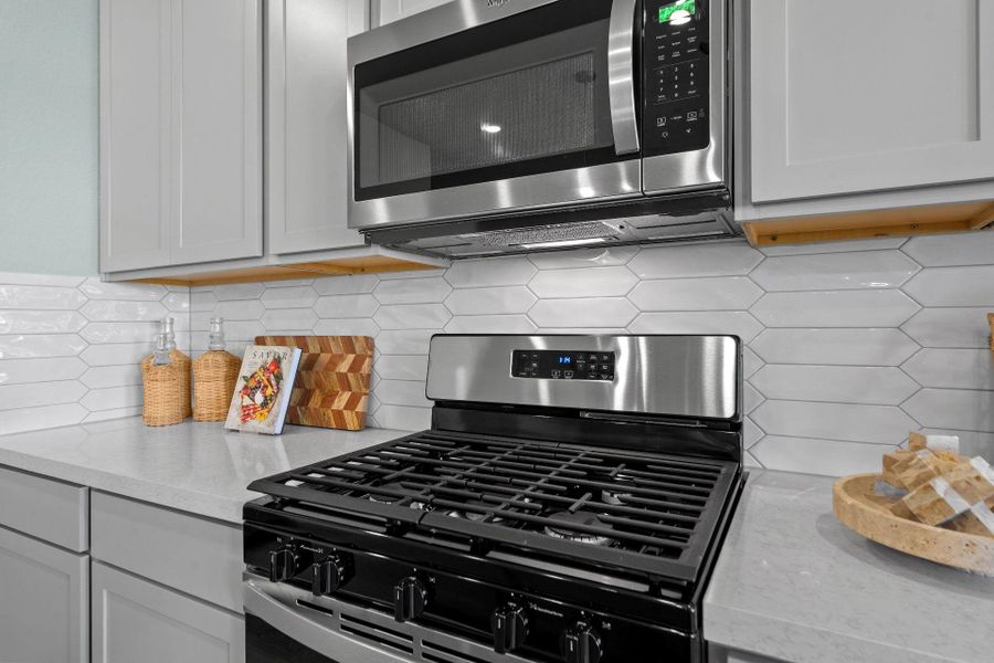 Stainless steel finishes in Light & Bright Kitchen - Representative Photo