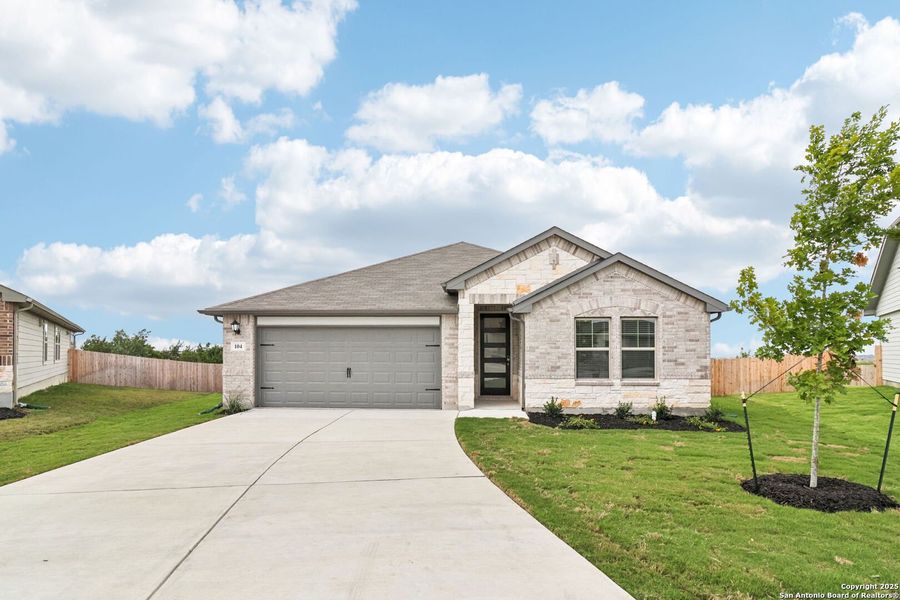 Front exterior of a new home in Legendary Trails - Classic Series, Cibolo, TX, highlighting curb appeal (Image 16).