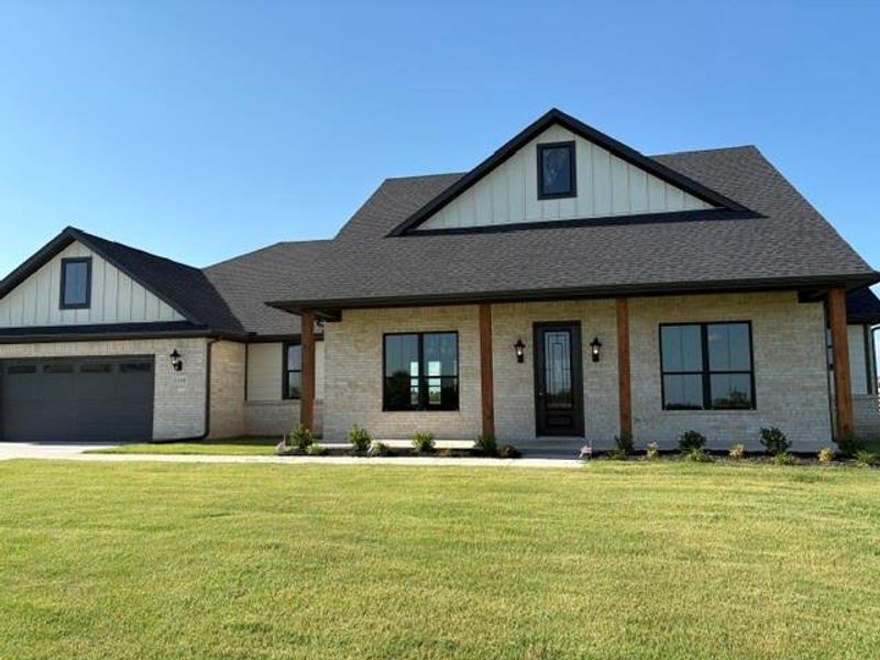 Front exterior of a new home in , Van Alstyne, TX, highlighting curb appeal (Image 20).