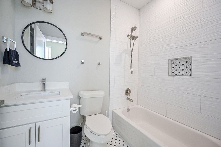 First floor: full bathroom with trendy accents and walk-in closet.