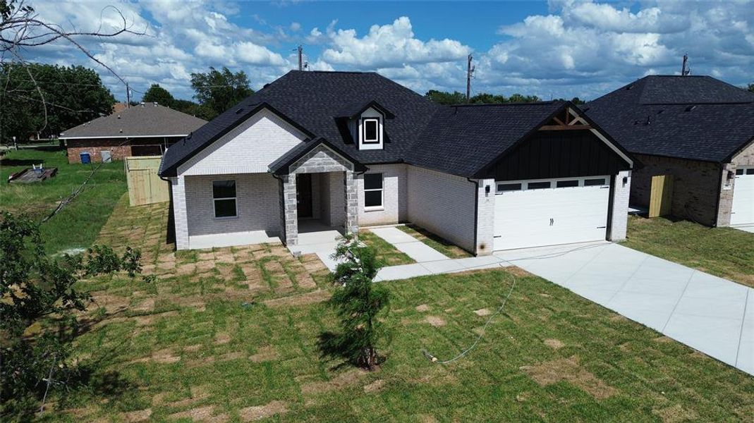 Front exterior of a new home in , Gun Barrel City, TX, highlighting curb appeal (Image 2). Front exterior of a new home in , Gun Barrel City, TX, highlighting curb appeal (Image 2).