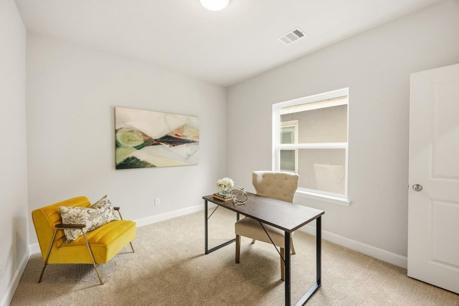 A secondary bedroom on the second floor presents a perfect blend of comfort and functionality, complete with window and proximity to the shared hall bathroom. A secondary bedroom on the second floor presents a perfect blend of comfort and functionality, complete with window and proximity to the shared hall bathroom.