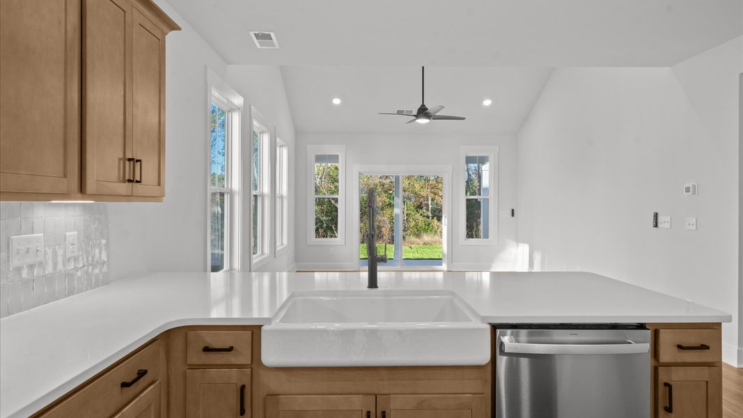 Highly skilled design choices create a clean, open kitchen with a central island Highly skilled design choices create a clean, open kitchen with a central island