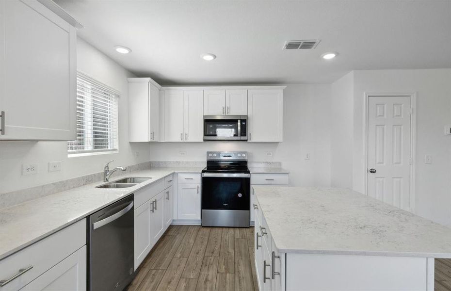 Bright kitchen with ample cabinet space *real home pictured