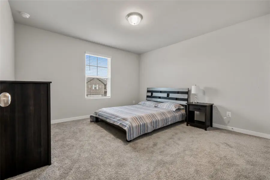 Comfortable secondary bedrooms offering versatility for family members, guests, home office, or hobby spaces. Each room is well-sized and designed with comfort in mind.