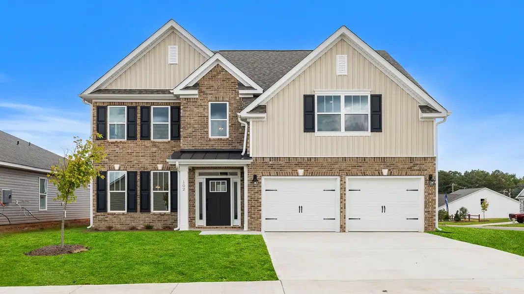 Front exterior of a new home in Seven Oaks, Greenwood, SC, highlighting curb appeal (Image 1). Front exterior of a new home in Seven Oaks, Greenwood, SC, highlighting curb appeal (Image 1).
