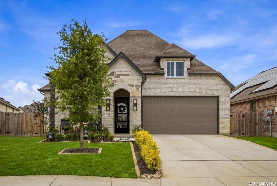 Front exterior of a new home in Alsatian Oaks, Castroville, TX, highlighting curb appeal (Image 21). Front exterior of a new home in Alsatian Oaks, Castroville, TX, highlighting curb appeal (Image 21).
