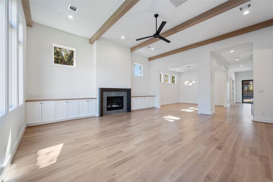 Huge great room with 13' ceiling and white oak wood beam ceiling detail