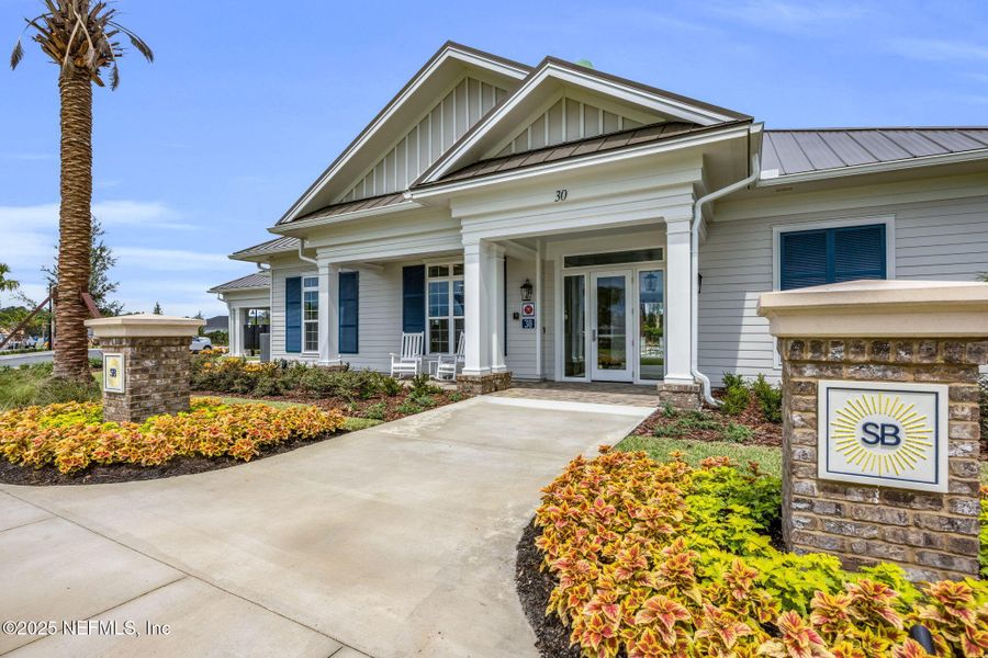 Front exterior of a new home in Summer Bay at Grand Oaks, St. Augustine, FL, highlighting curb appeal (Image 2).