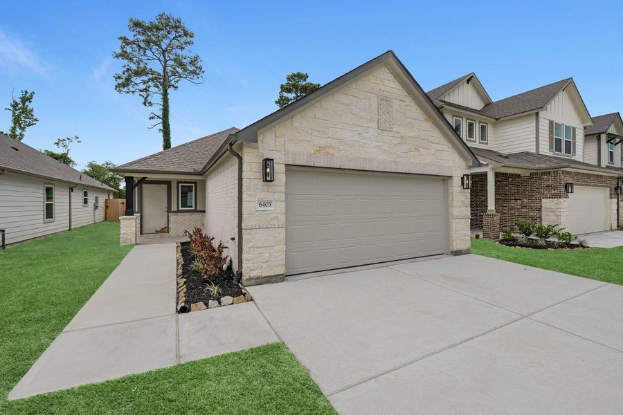 Front exterior of a new home in Cypresswood Landing, Humble, TX, highlighting curb appeal (Image 16).