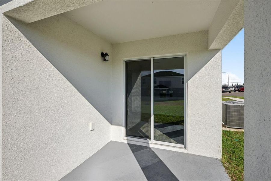 Exterior details and patio area of a home in The Enclave at Scenic Terrace, Haines City (Image 9).