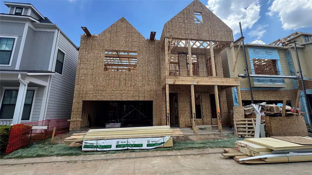 Front exterior of a new home in Timbergrove Trails, Houston, TX, highlighting curb appeal (Image 2).