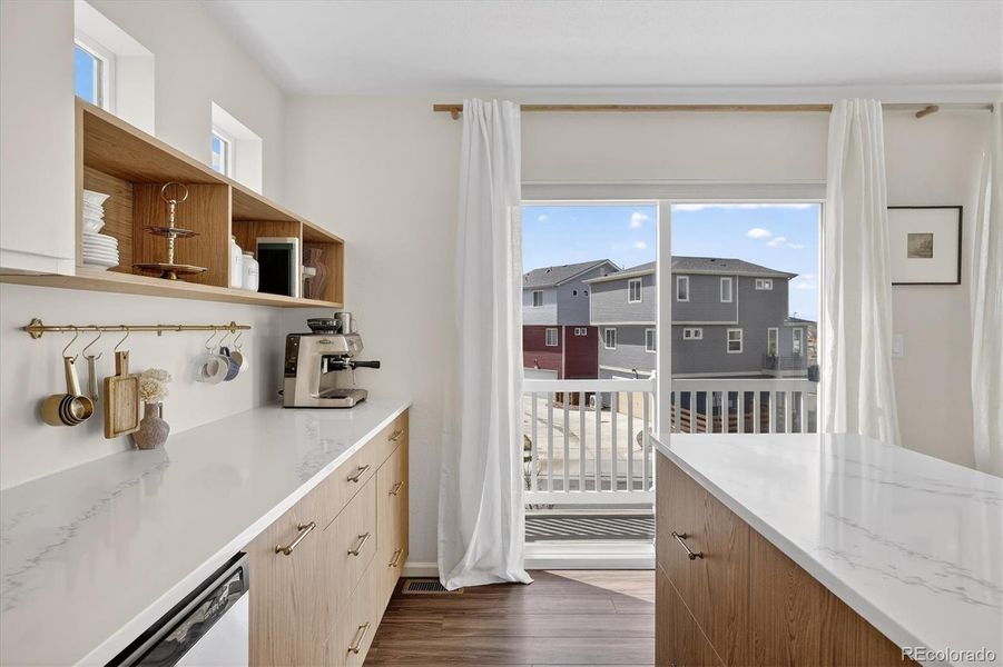 Extra cabinetry and sliding glass door to the balcony