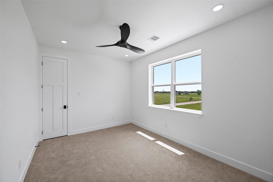 Spacious upstairs 4th bedroom with ample natural light.