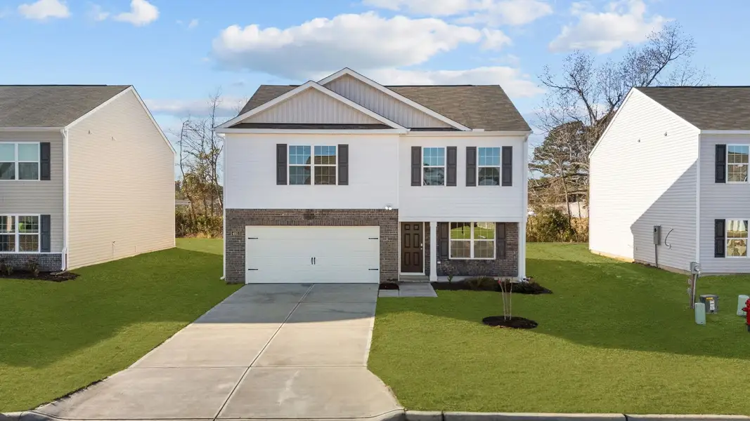Front exterior of a new home in Madeline Farm, New Bern, NC, highlighting curb appeal (Image 2). Front exterior of a new home in Madeline Farm, New Bern, NC, highlighting curb appeal (Image 2).