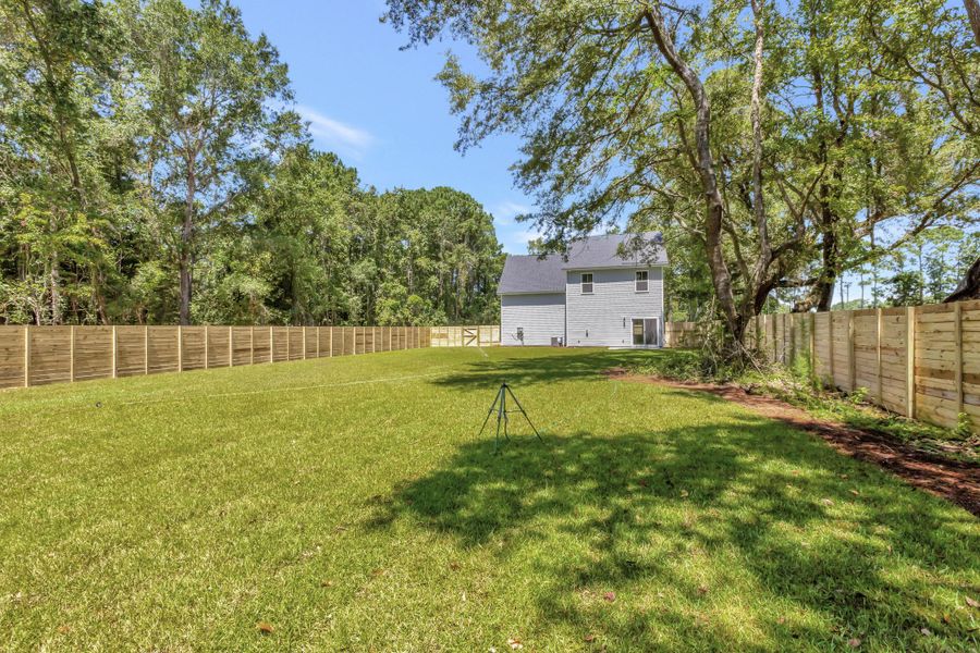 Front exterior of a new home in , Awendaw, SC, highlighting curb appeal (Image 11). Front exterior of a new home in , Awendaw, SC, highlighting curb appeal (Image 11).