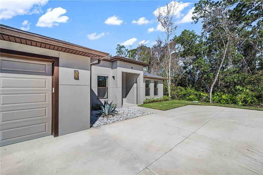 Front exterior of a new home in , Palm Coast, FL, highlighting curb appeal (Image 33).
