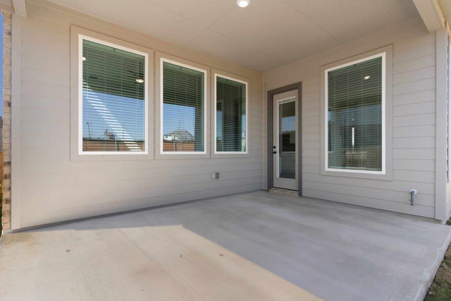 Exterior details and patio area of a home in Lariat, Liberty Hill (Image 4).