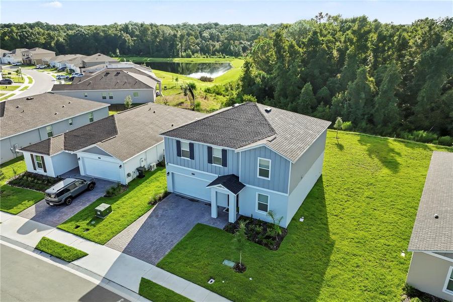 Front exterior of a new home in Providence, Davenport, FL, highlighting curb appeal (Image 21). Front exterior of a new home in Providence, Davenport, FL, highlighting curb appeal (Image 21).