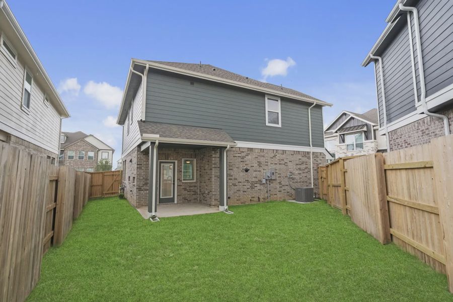 Exterior details and patio area of a home in Elyson Courtyard Collection, Katy (Image 3).