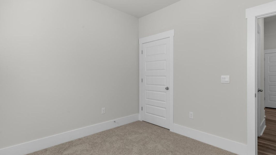 Spacious, unfurnished interior of a new home in Surfside Landing, Hubert (Image 24).