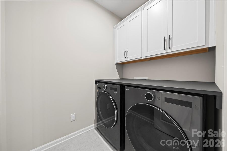 main level laundry room with custom folding shelf main level laundry room with custom folding shelf