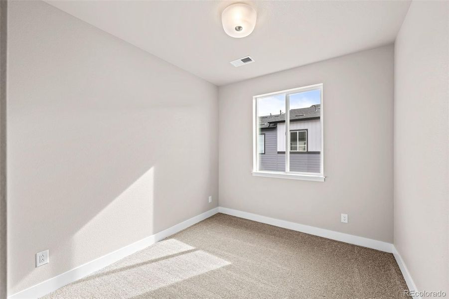 Spacious, unfurnished interior of a new home in Ralston Creek, Arvada (Image 22).