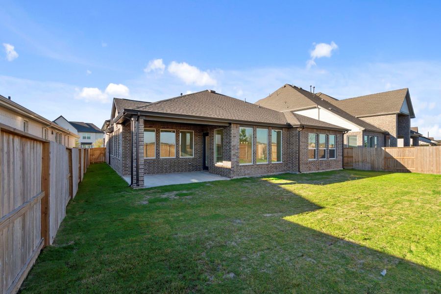 Exterior details and patio area of a home in Meridiana, Manvel (Image 4).