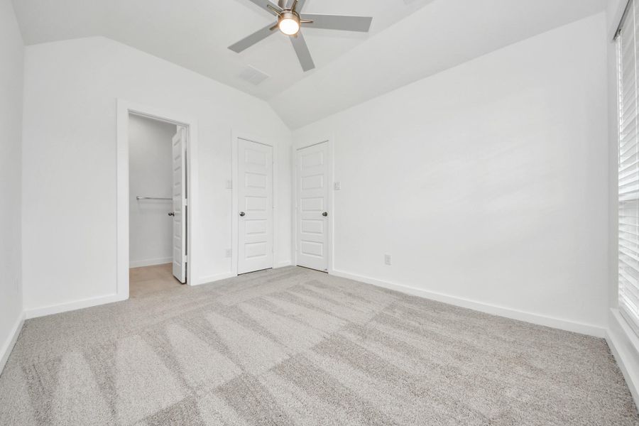Generously sized secondary bedrooms featuring spacious closets, soft and inviting carpeting underfoot, large windows allowing plenty of natural light, and the added touch of privacy blinds for your personal retreat. Sample photo of completed home with similar floor plan. Actual colors and selections may vary. Generously sized secondary bedrooms featuring spacious closets, soft and inviting carpeting underfoot, large windows allowing plenty of natural light, and the added touch of privacy blinds for your personal retreat. Sample photo of completed home with similar floor plan. Actual colors and selections may vary.