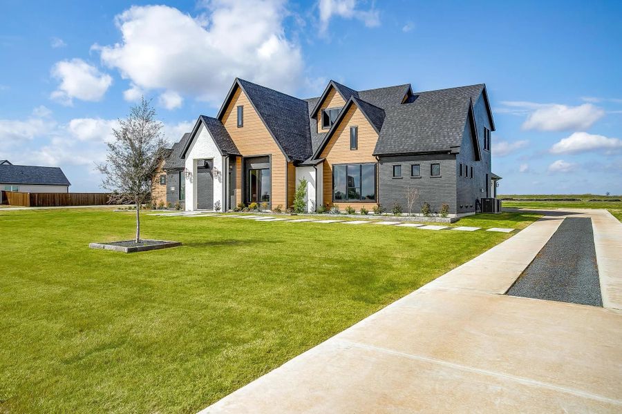 Representative exterior photo of a completed home built from the The Carley by Elmwood Custom Homes in Matthews Farm, Venus, TX (Image 2).
