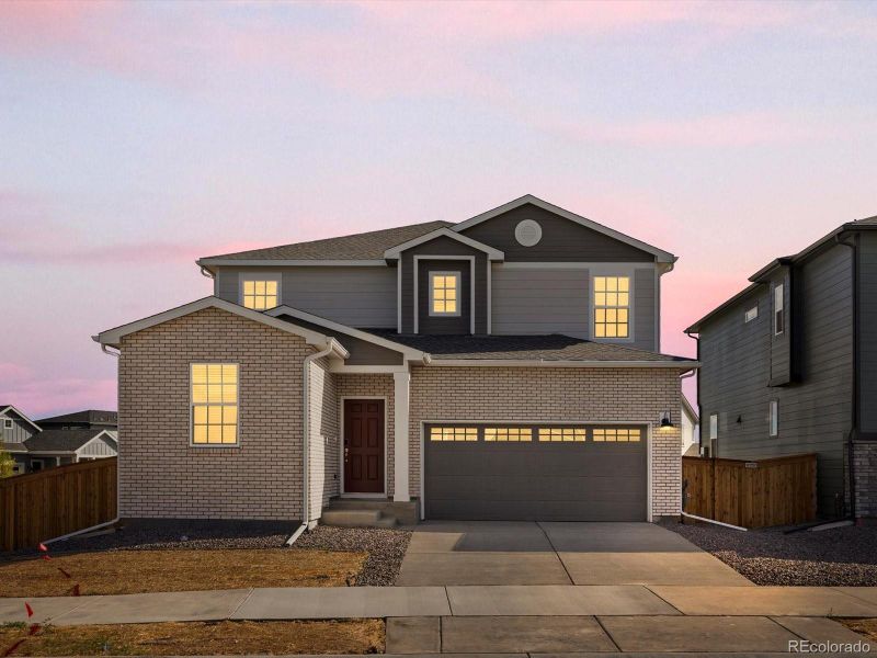 Front exterior of a new home in Ridgeline Vista: The Flora Collection, Brighton, CO, highlighting curb appeal (Image 20). Front exterior of a new home in Ridgeline Vista: The Flora Collection, Brighton, CO, highlighting curb appeal (Image 20).