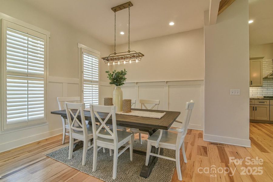 Dining room with accent wall. Virtually staged.