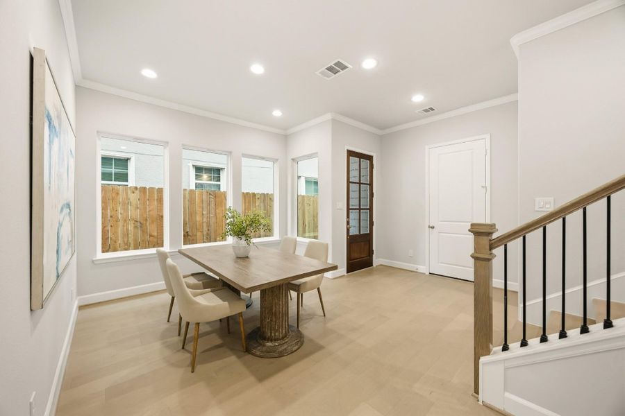 From another angle, the dining room reveals its generous proportions, ready to host your gatherings with grace and doors that open to welcome you home. From another angle, the dining room reveals its generous proportions, ready to host your gatherings with grace and doors that open to welcome you home.
