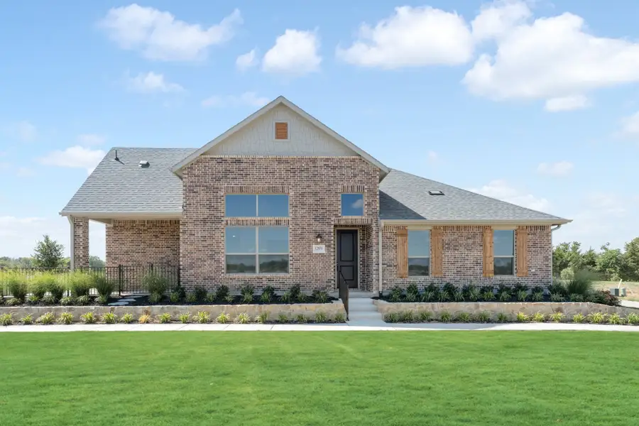 Front exterior of a new home in Cottonwood Creek, Rowlett, TX, highlighting curb appeal (Image 26).