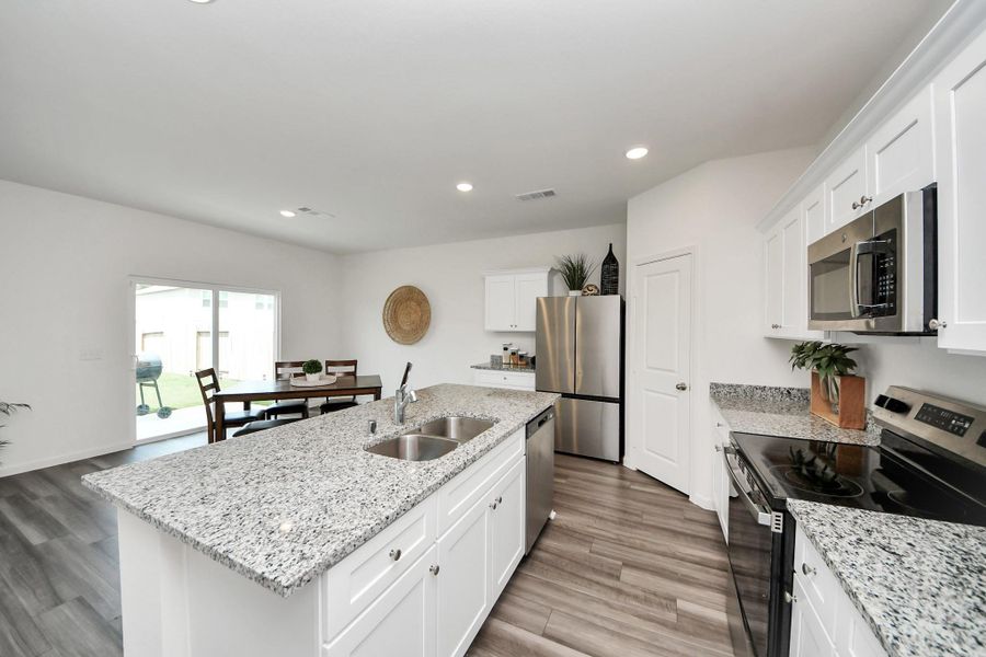This home comes complete with all stainless-steel appliances. The refrigerator pictured here is going however there is a brand new never used refrigerator that will take it's place and stay with the home.
