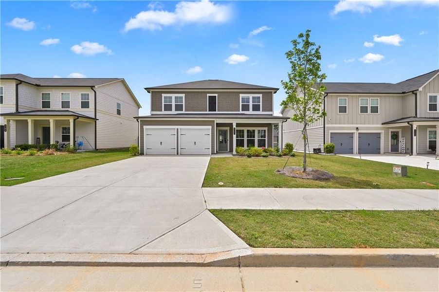 Front exterior of a new home in , Conyers, GA, highlighting curb appeal (Image 18).