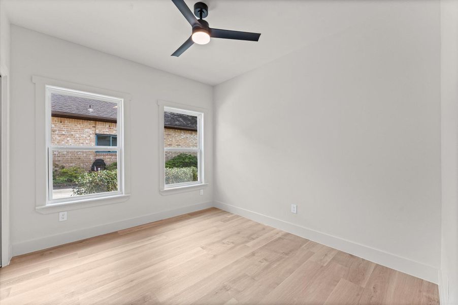 Bedroom # 4 is situated adjacent to the secondary bath. If a fourth bedroom isn't needed this can also be a great office/study or at-home gym.