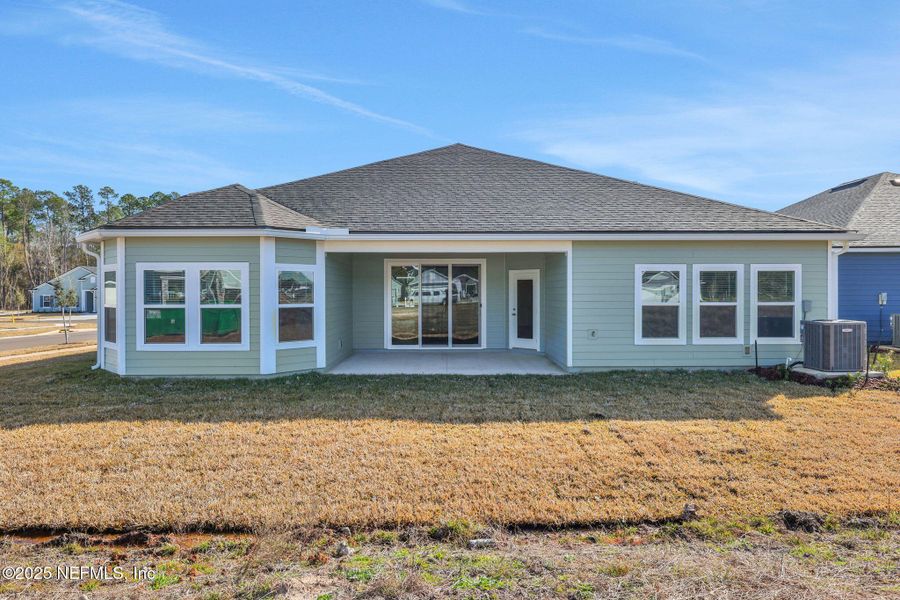 Front exterior of a new home in , Middleburg, FL, highlighting curb appeal (Image 25). Front exterior of a new home in , Middleburg, FL, highlighting curb appeal (Image 25).