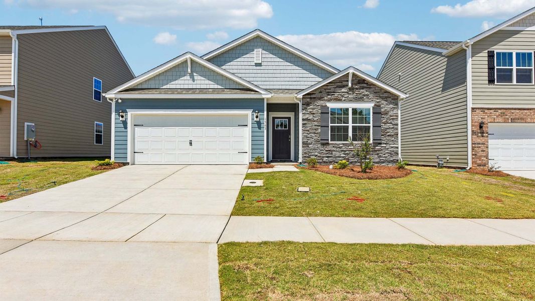 Front exterior of a new home in Laurelbrook, Sherrills Ford, NC, highlighting curb appeal (Image 1). Front exterior of a new home in Laurelbrook, Sherrills Ford, NC, highlighting curb appeal (Image 1).