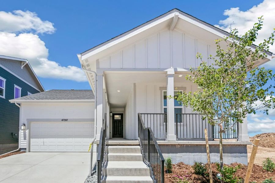 Front exterior of a new home in Bennett Crossing Classic, Bennett, CO, highlighting curb appeal (Image 1). Front exterior of a new home in Bennett Crossing Classic, Bennett, CO, highlighting curb appeal (Image 1).