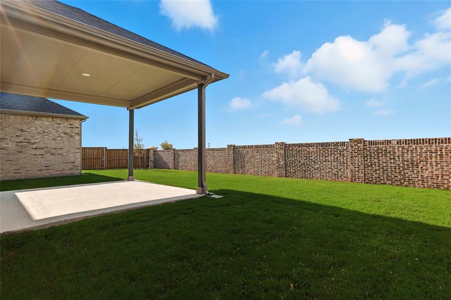 Fenced backyard with a patio Fenced backyard with a patio