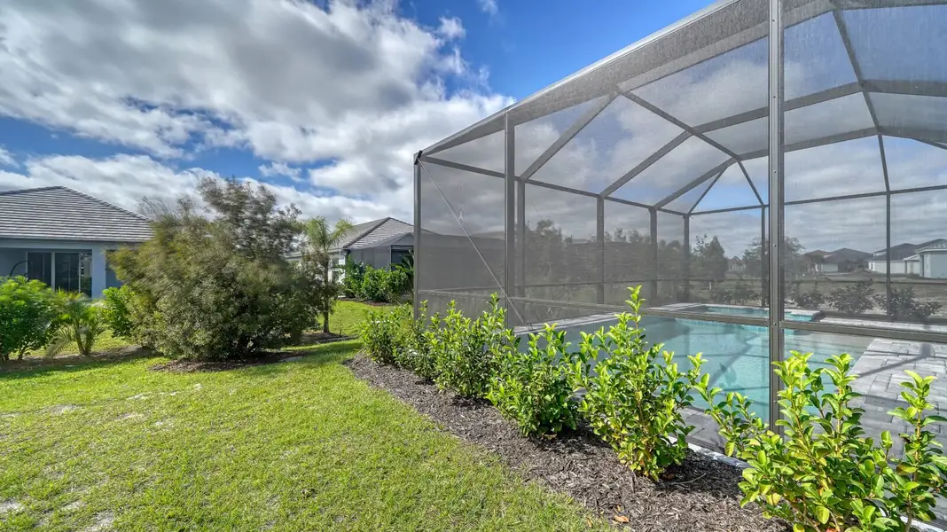 Exterior details and patio area of a home in Windward, Sarasota (Image 3).