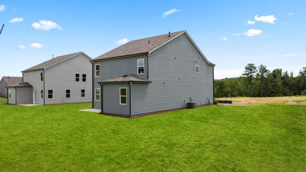 Front exterior of a new home in Sheffield Highlands, Dallas, GA, highlighting curb appeal (Image 24). Front exterior of a new home in Sheffield Highlands, Dallas, GA, highlighting curb appeal (Image 24).