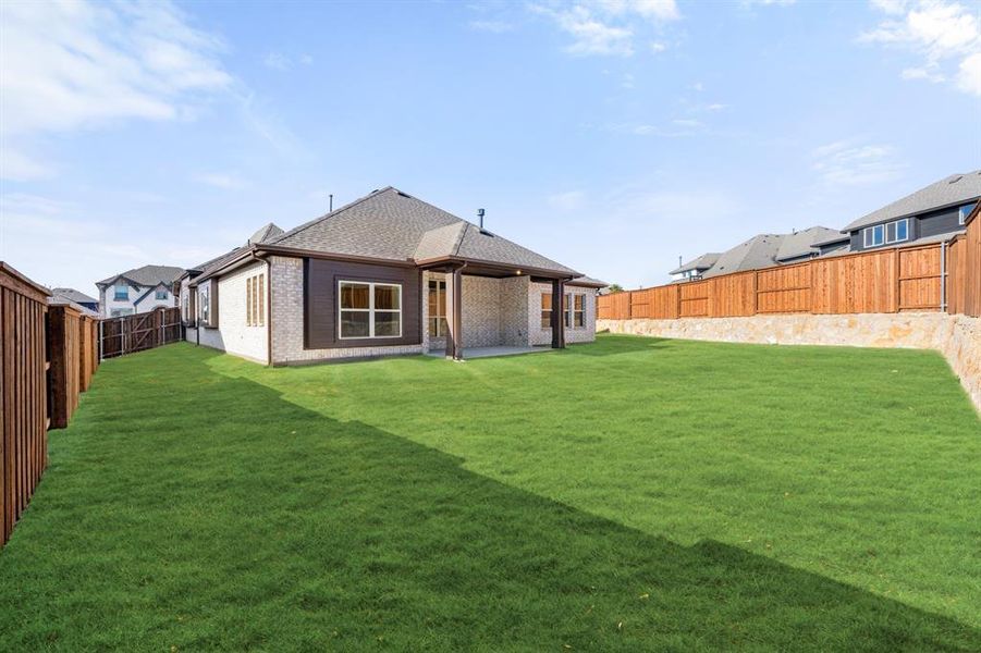 Exterior details and patio area of a home in Windsong Ranch, Prosper (Image 27).