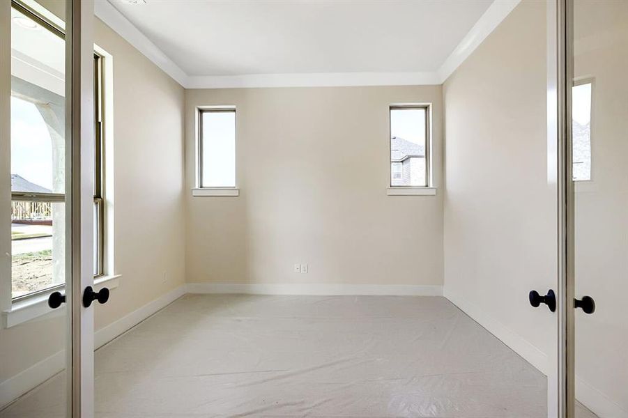 Spare room with french doors and crown molding Spare room with french doors and crown molding