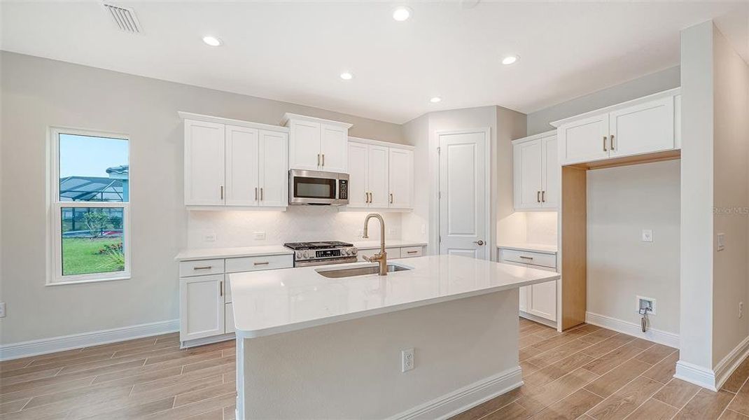 Furnished interior view inside a new home in Grand Park, Sarasota (Image 6).