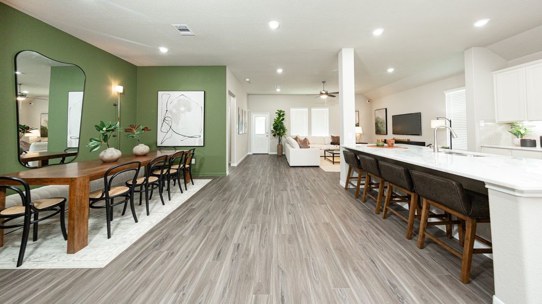 Dining Area and Kitchen to Family Room Dining Area and Kitchen to Family Room