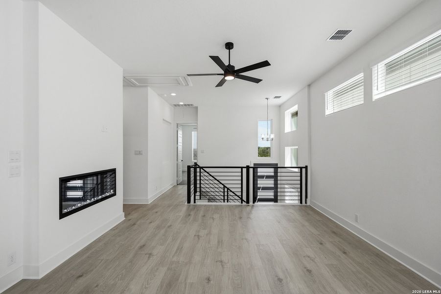Spacious, unfurnished interior of a new home in Centero at Stone Oak, San Antonio (Image 32).