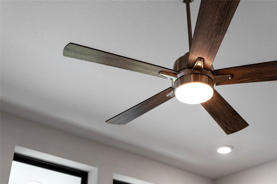 A sleek and modern ceiling fan that provides both air circulation and light to the room.