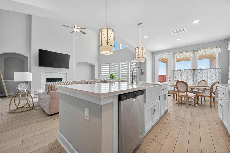 Bright and open, this kitchen's island is the centerpiece between the cozy breakfast nook and spacious living room. Ideal for entertaining, the layout blends charm and convenience effortlessly.